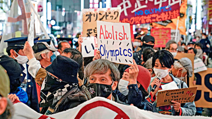 Anti-Olympic demonstrators took to the streets of Tokyo in March after the torch relay began.undefined